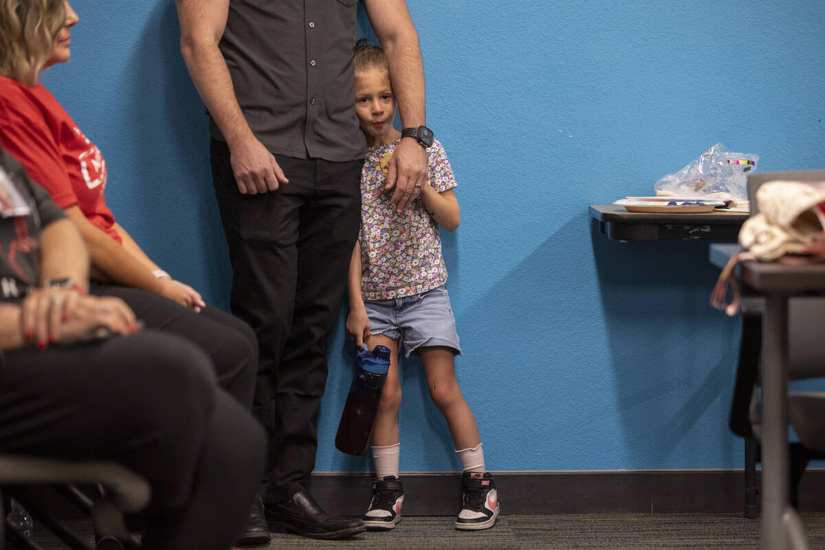 Councilman Brian Knudsen’s daughter Kate stands next to her father during UNLV School of ...