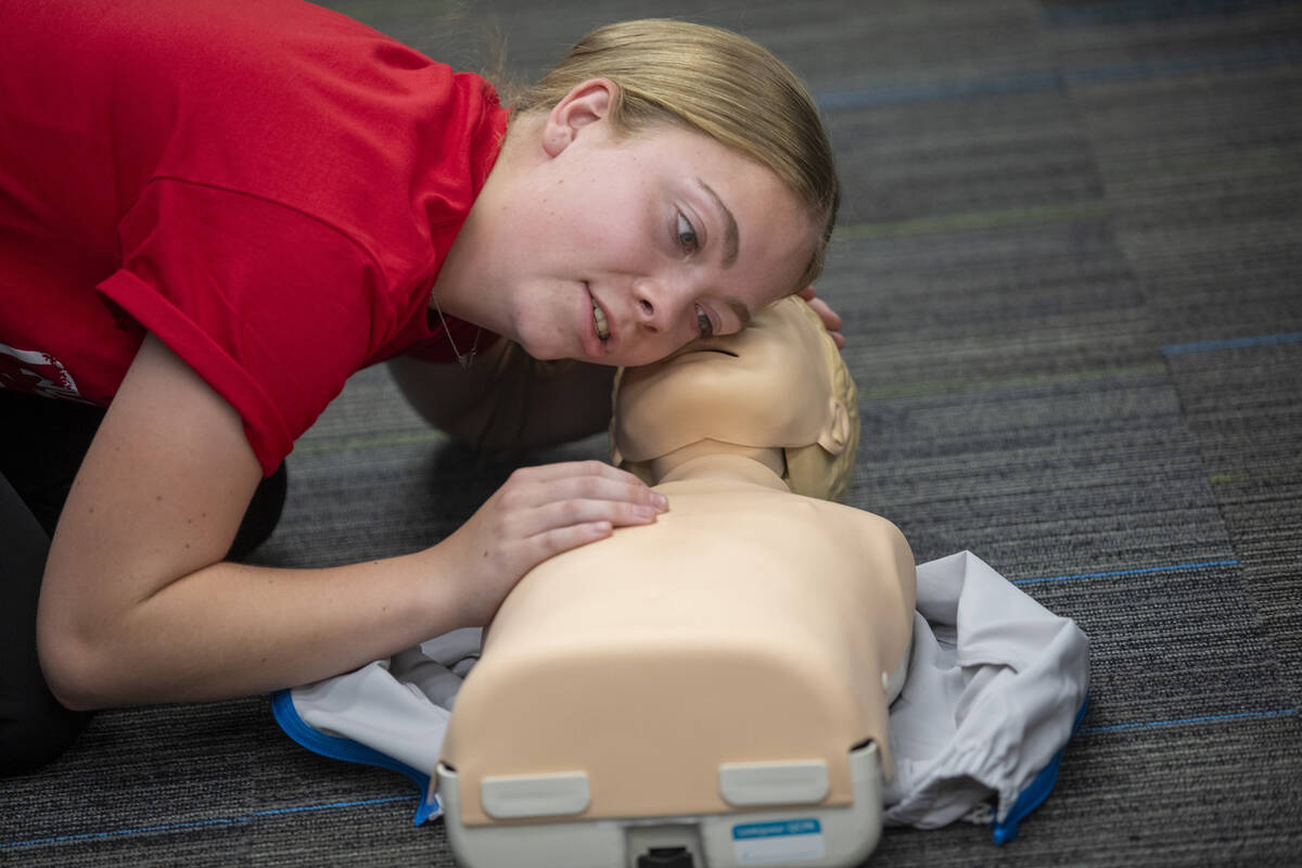 Rylie Tuke, 16, practices CPR on a mannequin during UNLV School of Nursing's 5th annual Nurse C ...