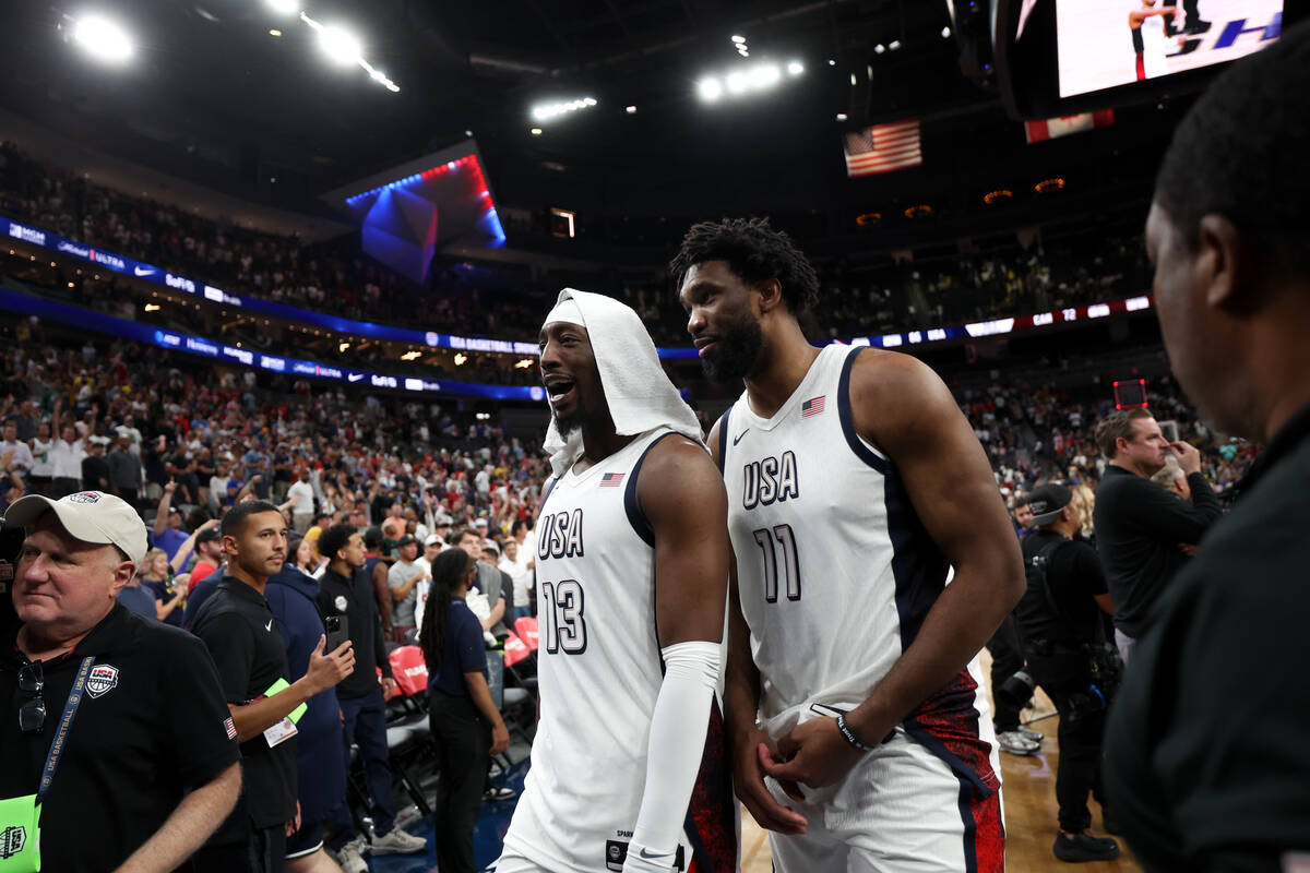USA center Bam Adebayo (13) and center Joel Embiid (11) leave the court after defeating Canada ...