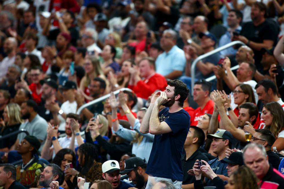 Fans cheer during the second half of a showcase basketball game between the USA and Canada at T ...