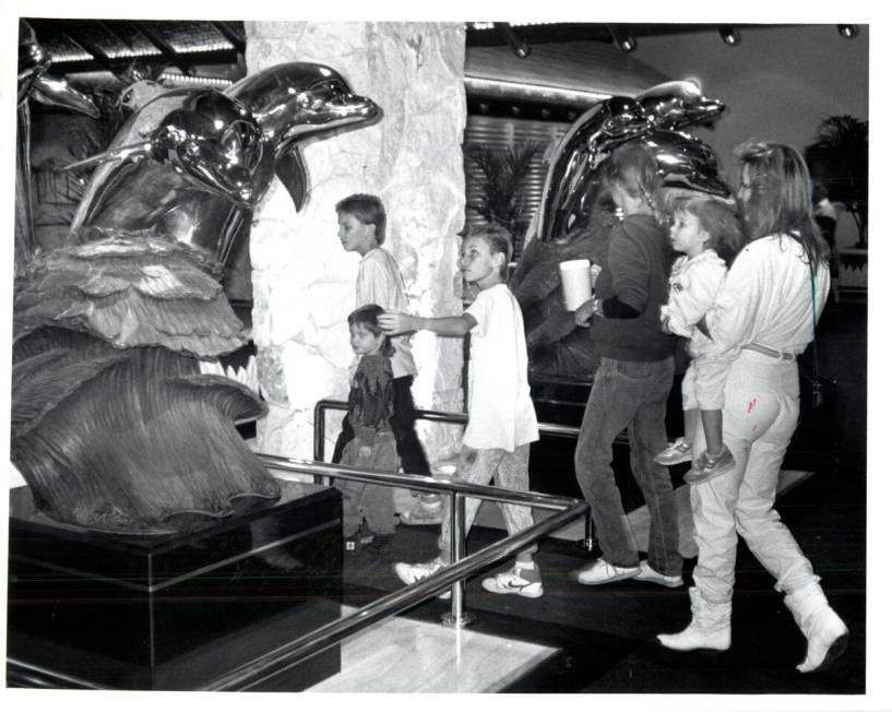 Las Vegas Review-Journal NOV 22, 1989 Sculpted dolphins greet visitors at main entrance of Mir ...