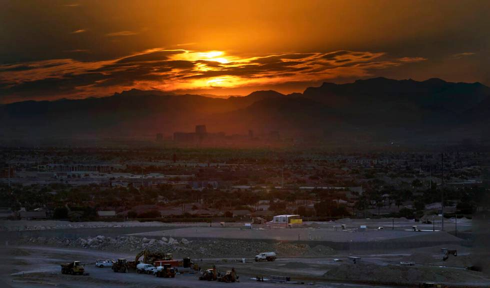 The sun rises over the valley and Strip on another high temperature day on Thursday, July 20, 2 ...