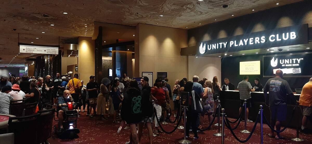 Mirage guests wait in line to join the resort's loyalty program to be eligible to win extra cas ...