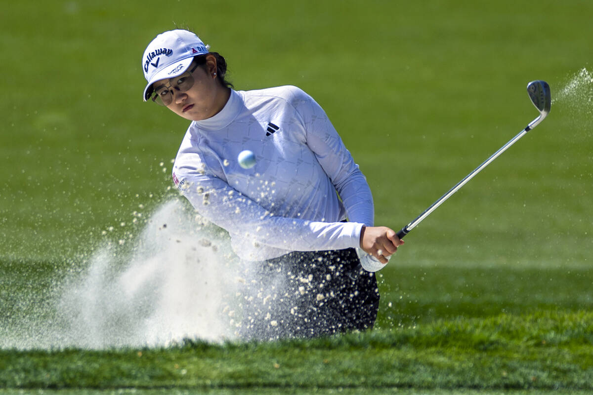 Rose Zhang digs out of a sand trap on hole #7 during the second day of the LPGA T-Mobile Match ...