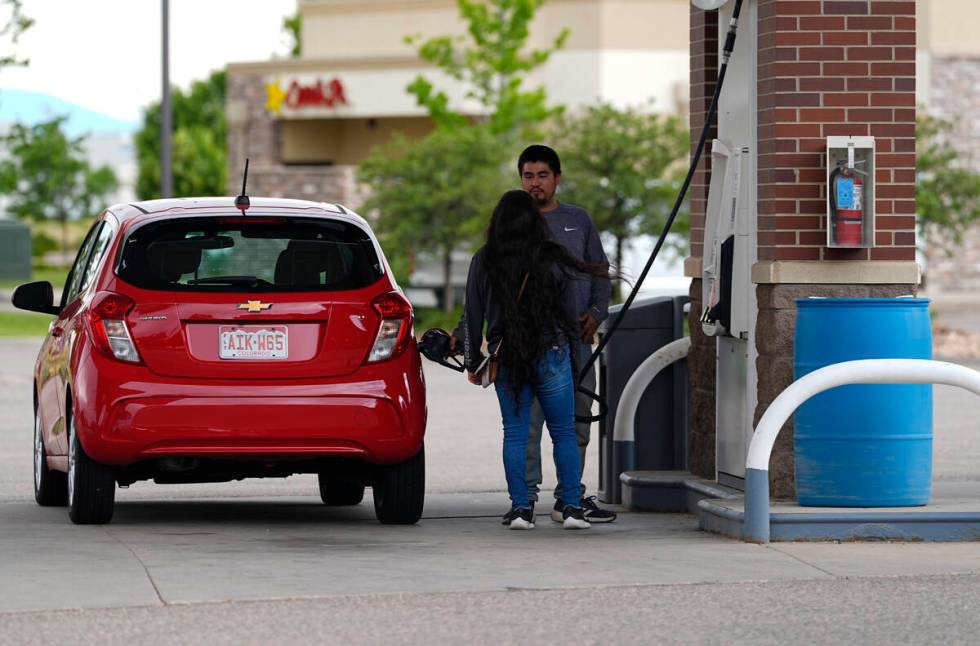 Motorists fill up the tank of a car at a gasoline station on Tuesday, June 25, 2024, in Lovelan ...