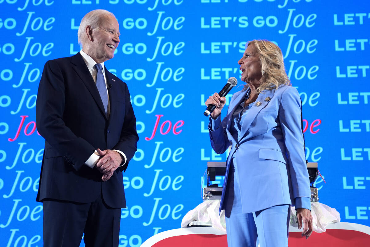 President Joe Biden, left, and first lady Jill Biden speak at a presidential debate watch party ...