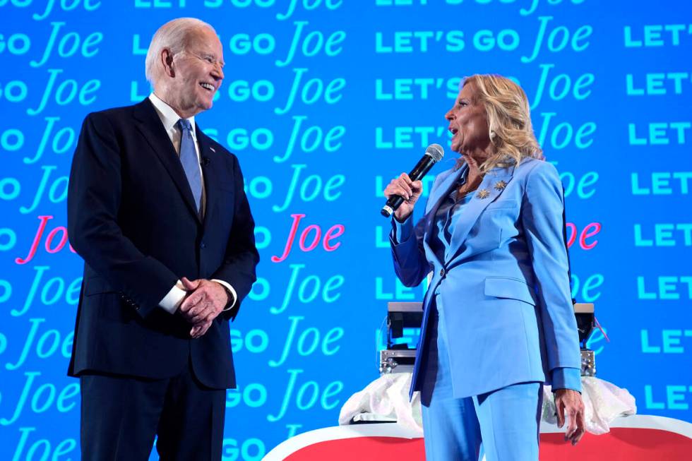 President Joe Biden, left, and first lady Jill Biden speak at a presidential debate watch party ...