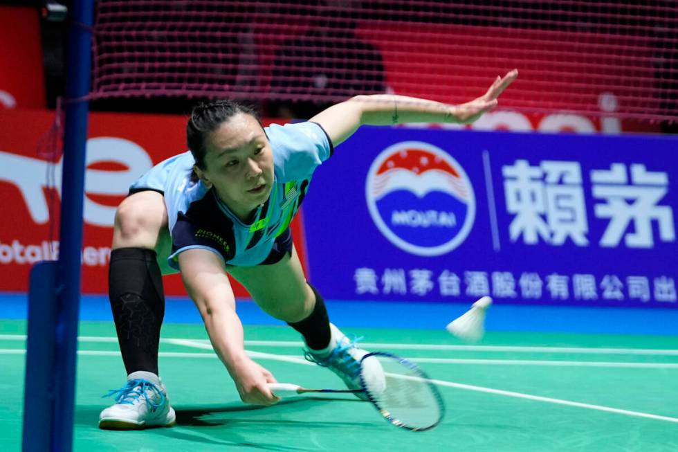 Beiwen Zhang of the U.S. plays a return during a badminton game of the women's singles against ...