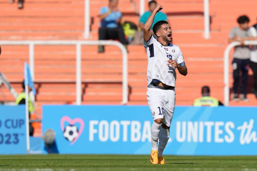 Dominican Republic's Edison Azcona celebrates scoring the opening goal against Nigeria during a ...