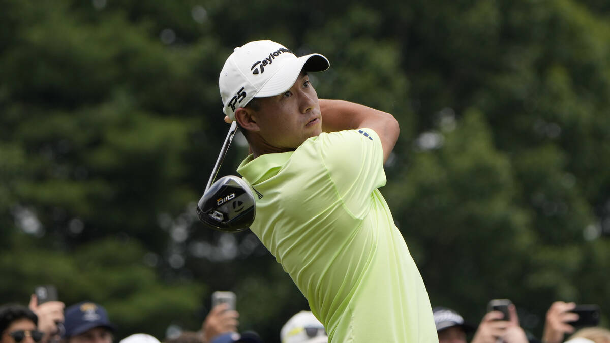 Collin Morikawa hits from the first tee during the third round of the Travelers Championship go ...