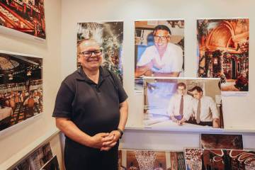 Paul Steelman poses with photographs from when he worked side by side with Steve Wynn as an arc ...