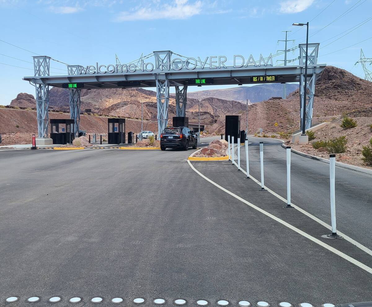 A passenger vehicle passes through a new toll plaza built near Hoover Dam on July 10, 2024. (Ri ...