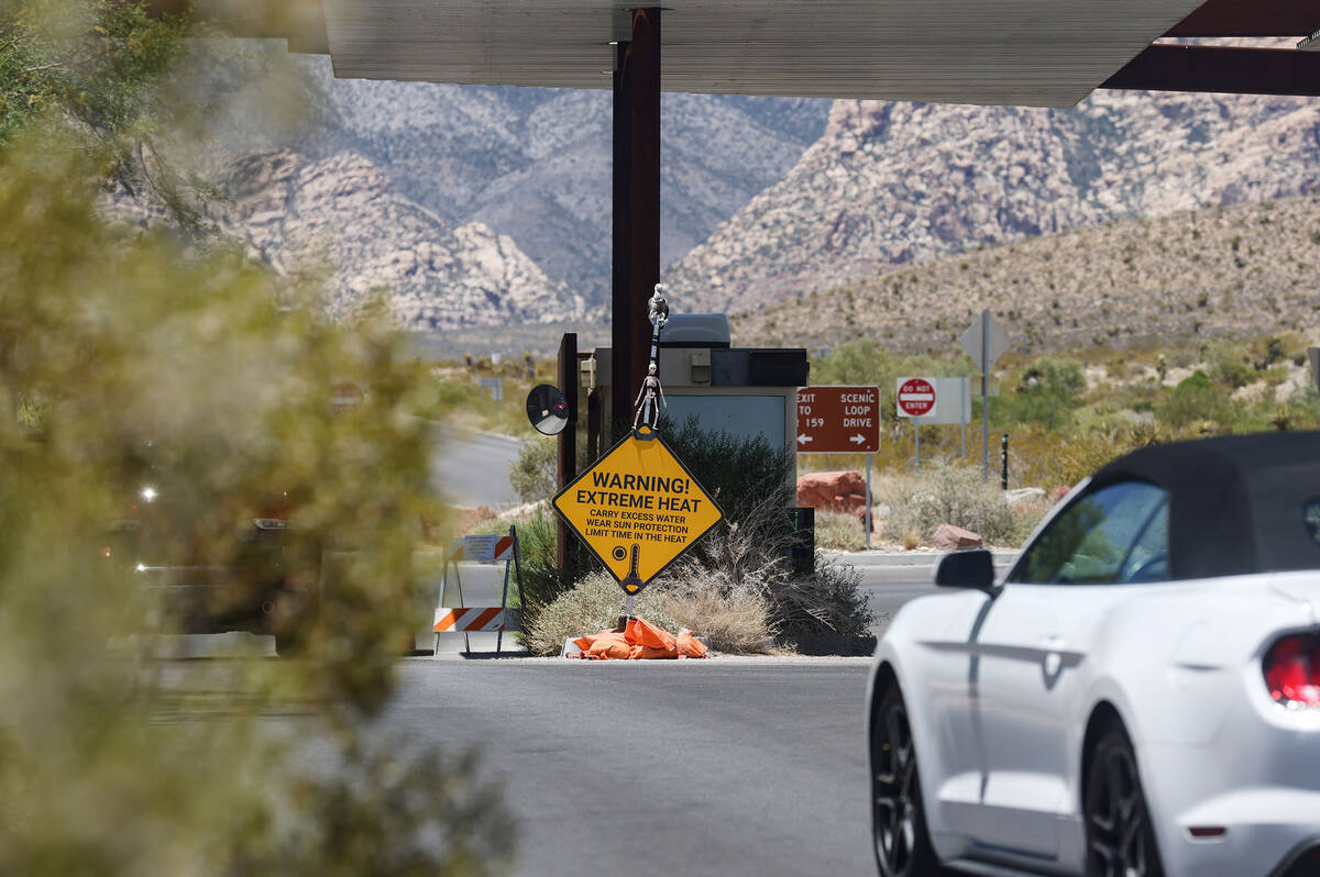 Signs warning of extreme heat at the entrance to the scenic loop of the Red Rock Canyon Nationa ...