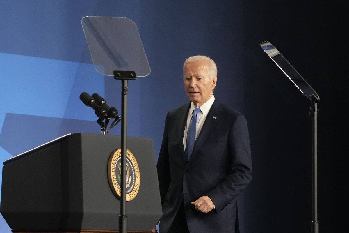 President Joe Biden approaches the podium to begin his news conference Thursday, July 11, 2024, ...