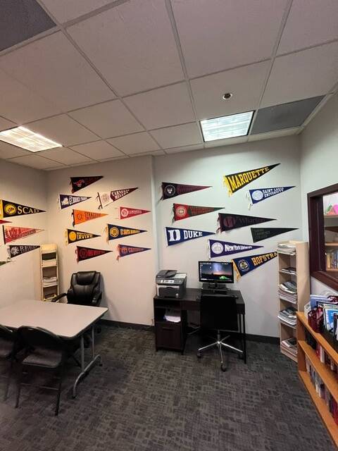 University flags of colleges students attended after working with the ACS Foundation. (Courtesy ...
