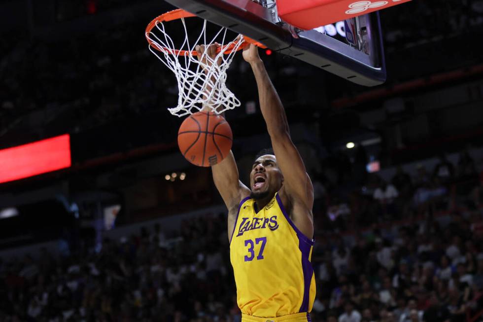 Los Angeles Lakers forward Armel Traoré dunks during the first half of an NBA summer leagu ...