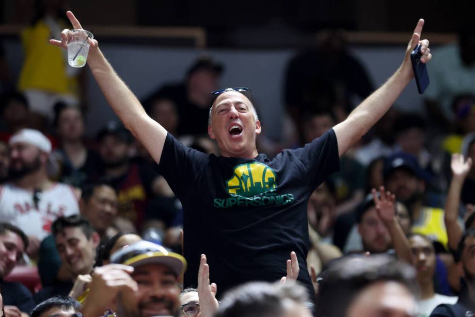 A fan cheers during the second half of an NBA summer league basketball game between the Los Ang ...