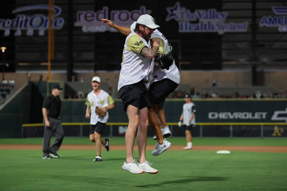 Former Golden Knights goaltender Logan Thompson, left, and Knights manual therapist Raul Dorant ...