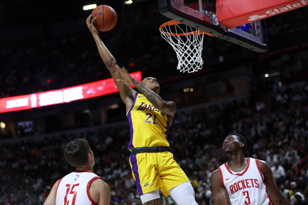 Los Angeles Lakers forward Maxwell Lewis (21) shoots against Houston Rockets guard Reed Sheppar ...