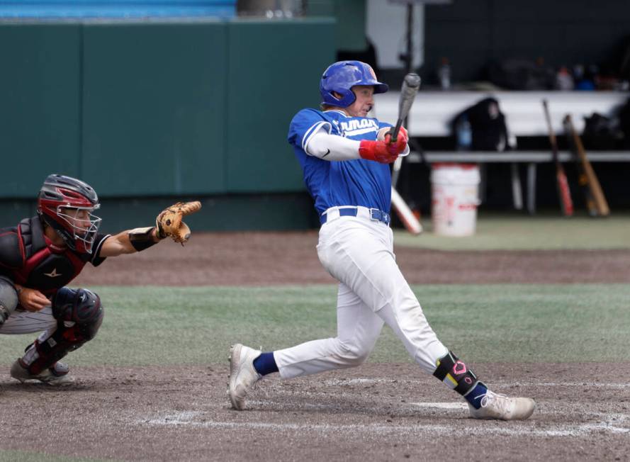 Bishop Gorman's Burke Mabeus connects for a hit against Desert Oasis during a Class 5A high sch ...