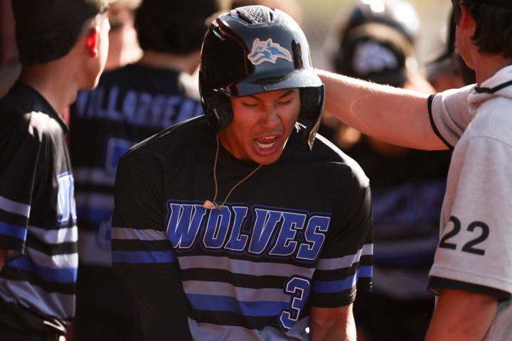 Basic shortstop Ty Southisene (3) celebrates after scoring during a high school baseball game a ...