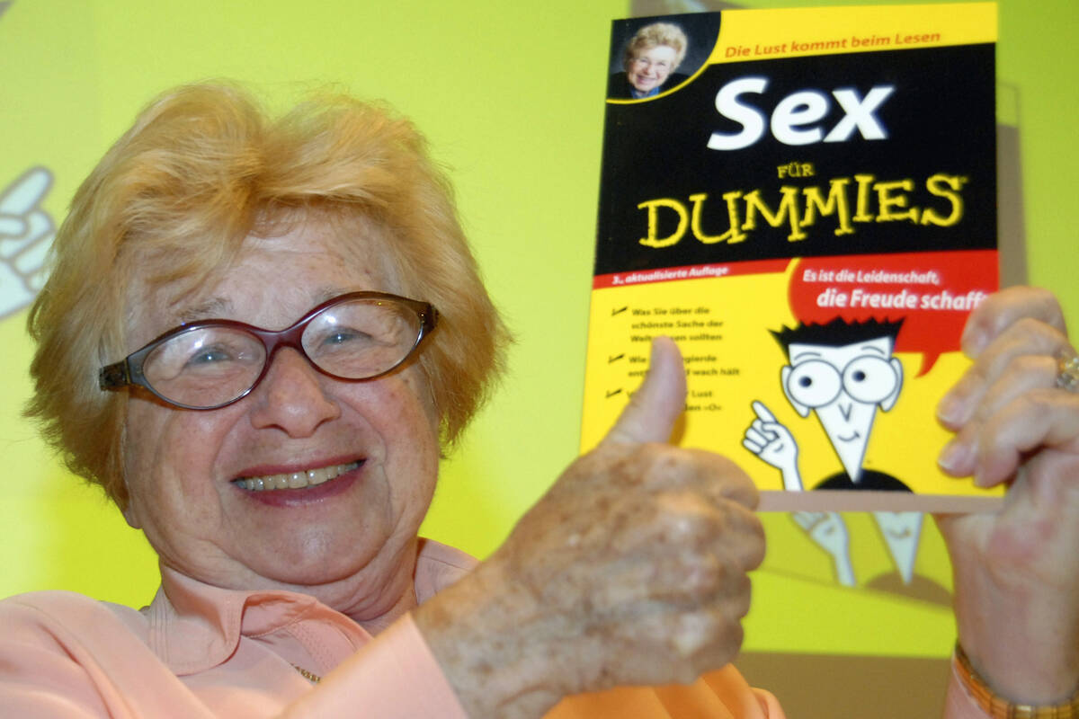 Dr. Ruth Westheimer holds a copy of her book "Sex for Dummies" at the International F ...