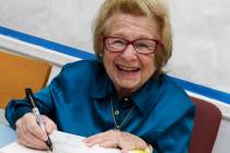 FILE - Dr. Ruth Westheimer signs a copy of her book "Sexually Speaking" in New York o ...
