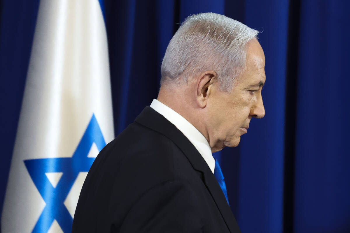 Israeli Prime Minister Benjamin Netanyahu arrives to speak during a press conference in Tel Avi ...