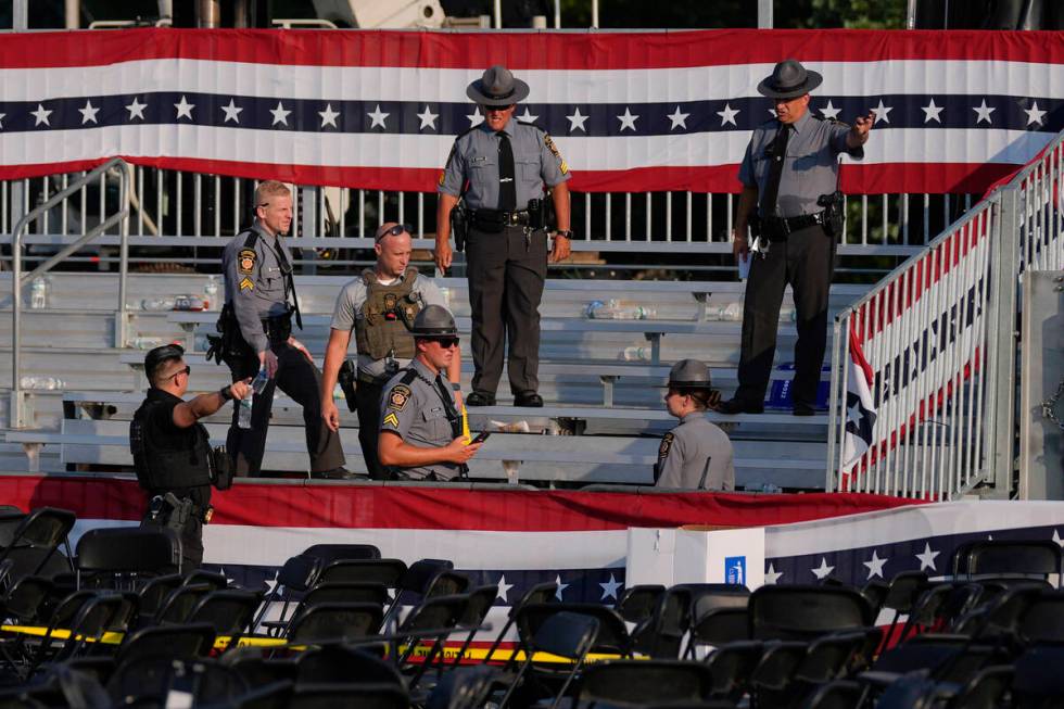 Law enforcement officers gather at campaign rally site for Republican presidential candidate fo ...