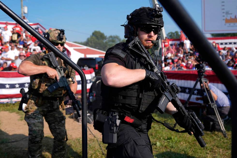 U.S. Secret Service agents surround the stage during a campaign rally with Republican president ...