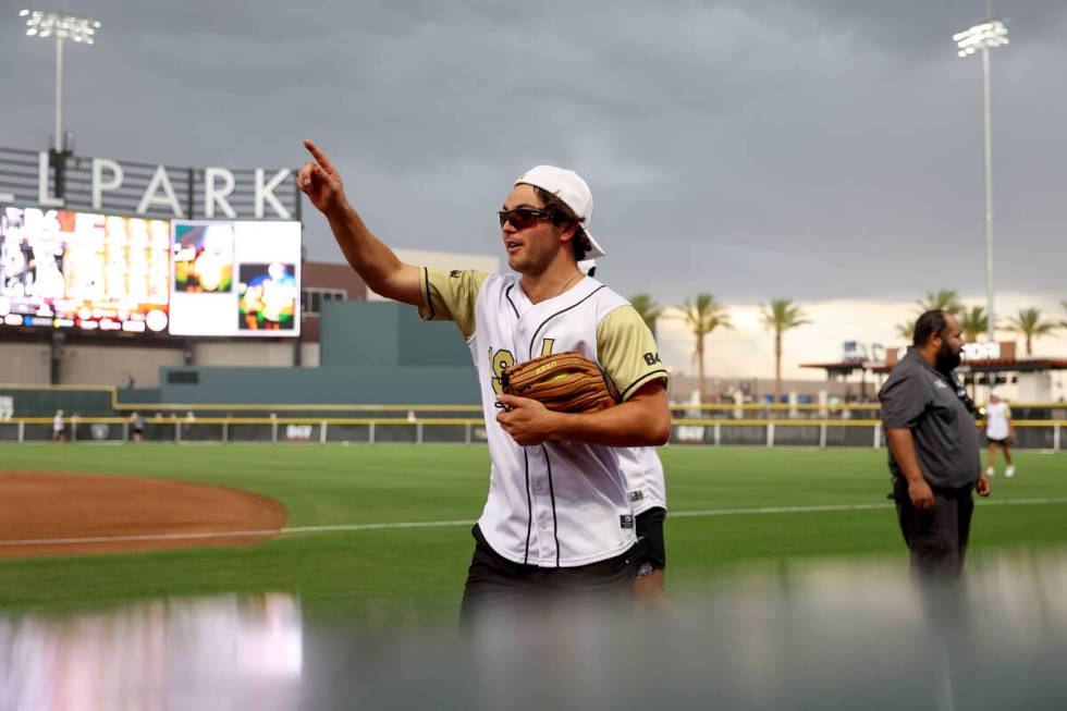 Brendan Brisson of the Golden Knights gestures to his team under stormy skies during the annual ...