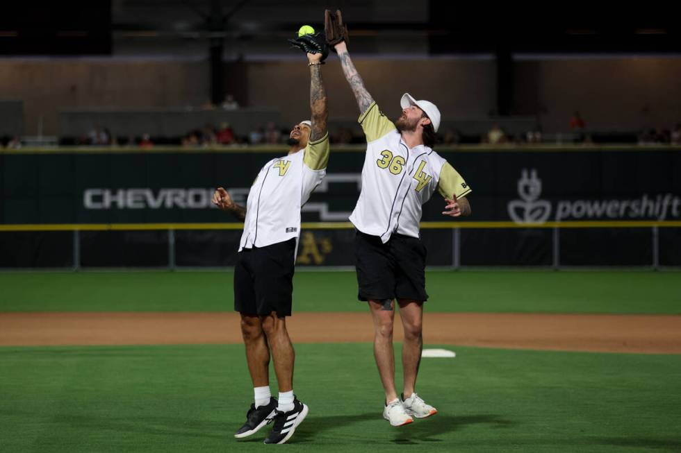 Former Golden Knights Ryan Reaves, left, and Logan Thompson vie for the final out of the game d ...