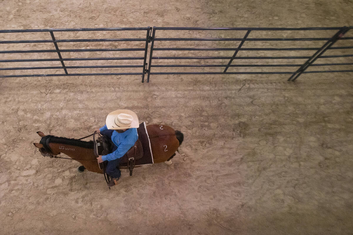 Jerrad Dittmer, of Millsap, Texas, waits in a chute during the Mustang Challenge at South Point ...