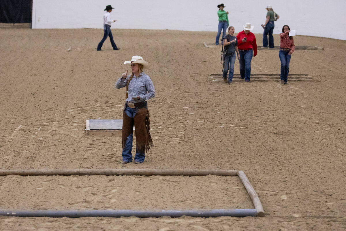 Competitors walk the Trail Class pattern before the Mustang Challenge at South Point Arena, Fri ...