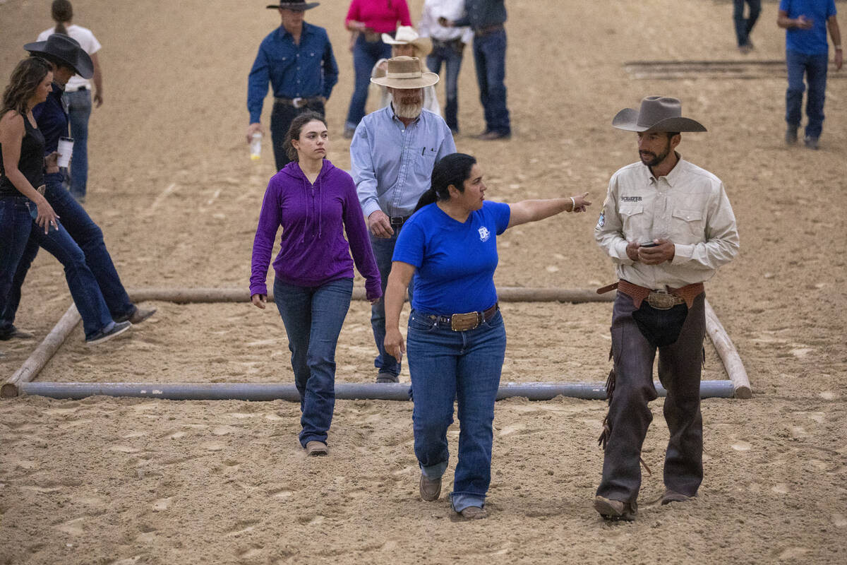 Competitors walk the Trail Class pattern before the Mustang Challenge at South Point Arena, Fri ...