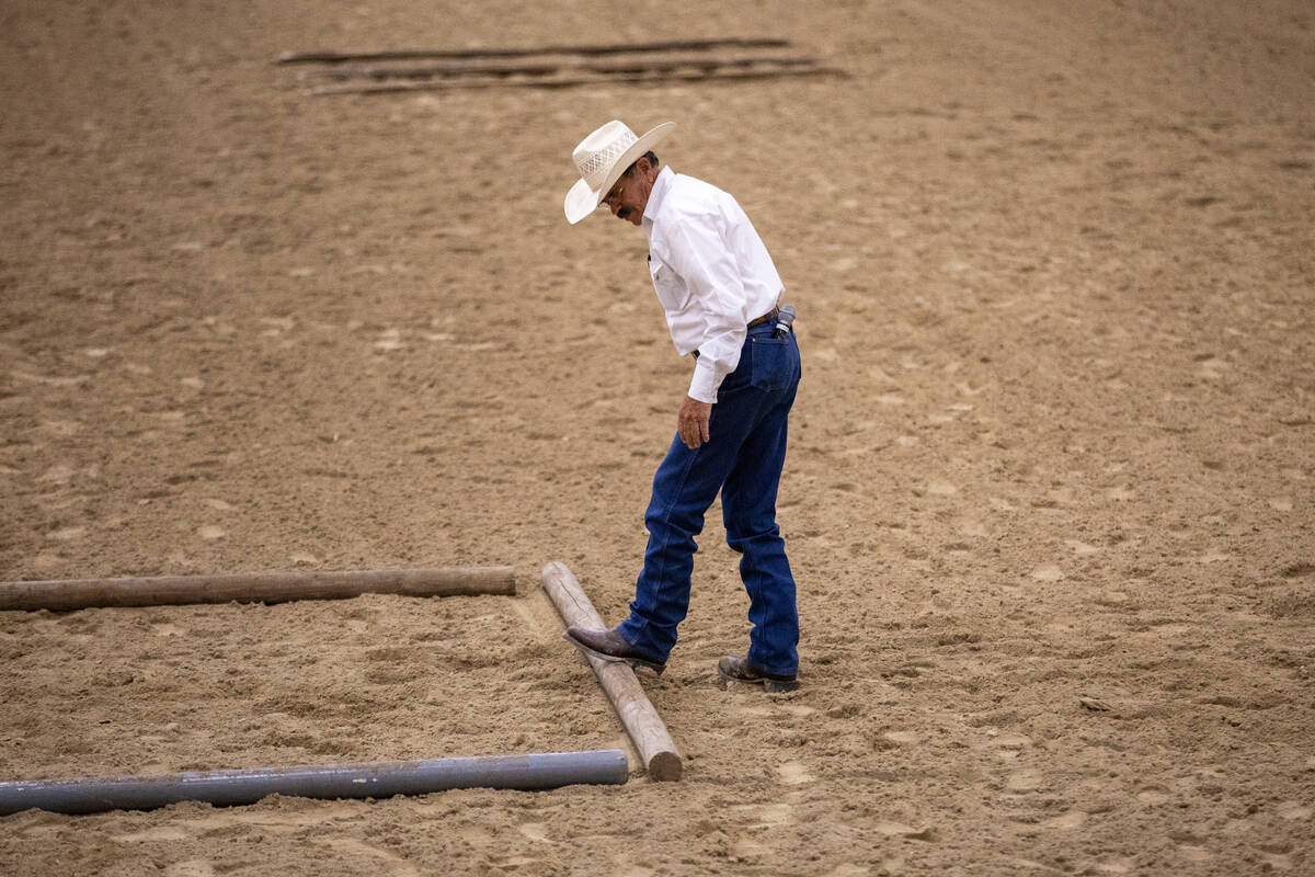 Event Director Stormy Mullins fixes a pole during the Mustang Challenge at South Point Arena, F ...