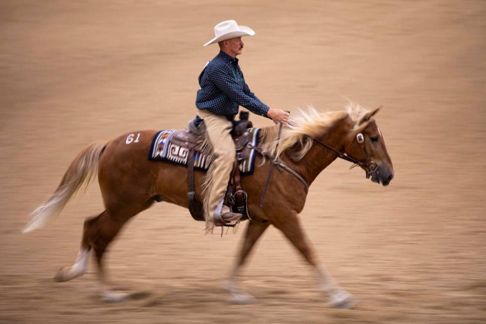 Jeff Cook, of Tucson, Arizona, competes during the Mustang Challenge at South Point Arena, Frid ...
