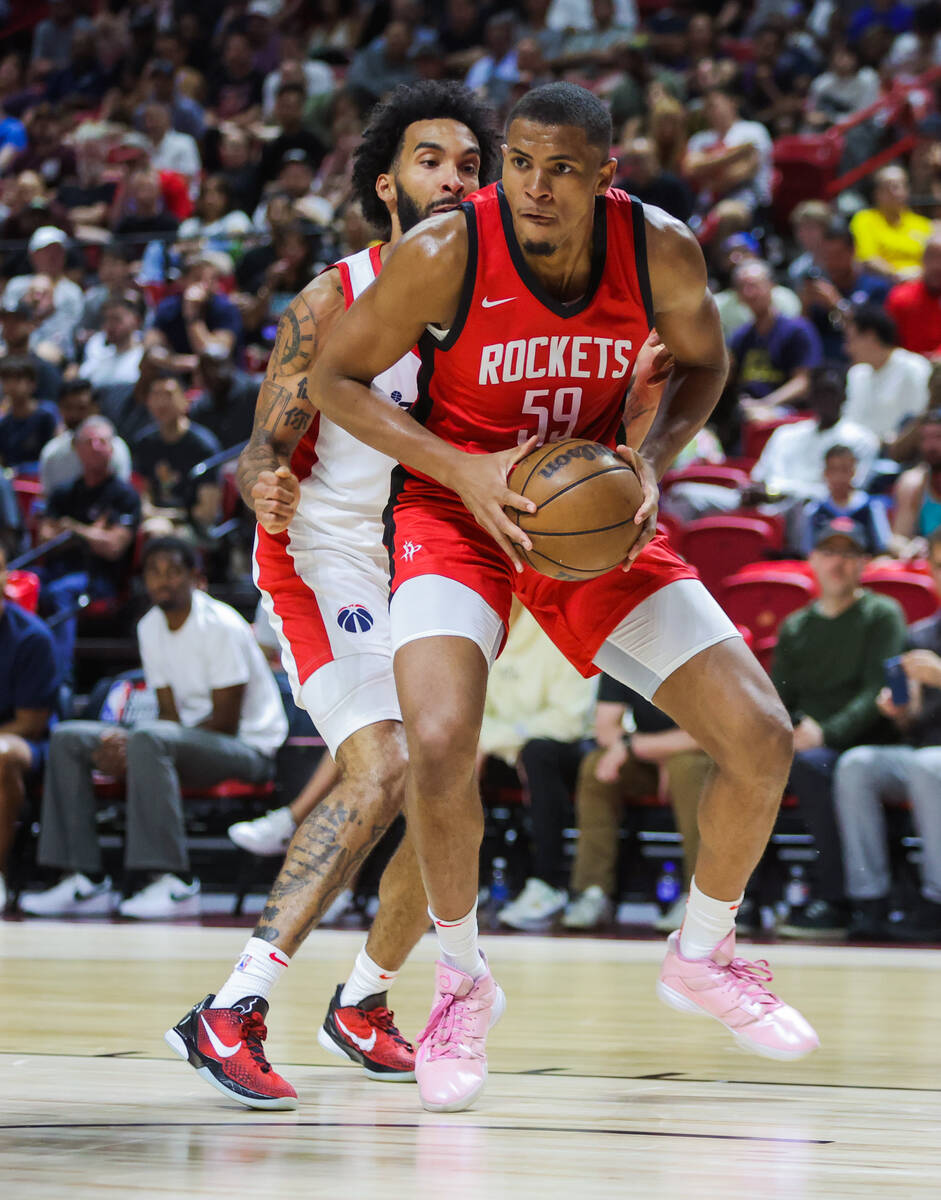 Houston Rockets center Orlando Robinson (59) keeps hold of the ball during an NBA Summer League ...