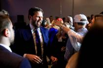 JD Vance greets supporters during an election night watch party. (AP Photo/Aaron Doster)