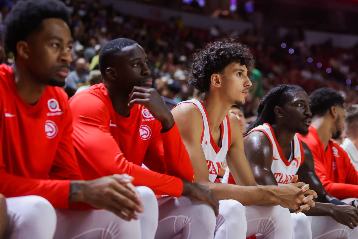 Atlanta Hawks forward Zaccharie Risacher (middle) watches from the bench during an NBA Summer L ...