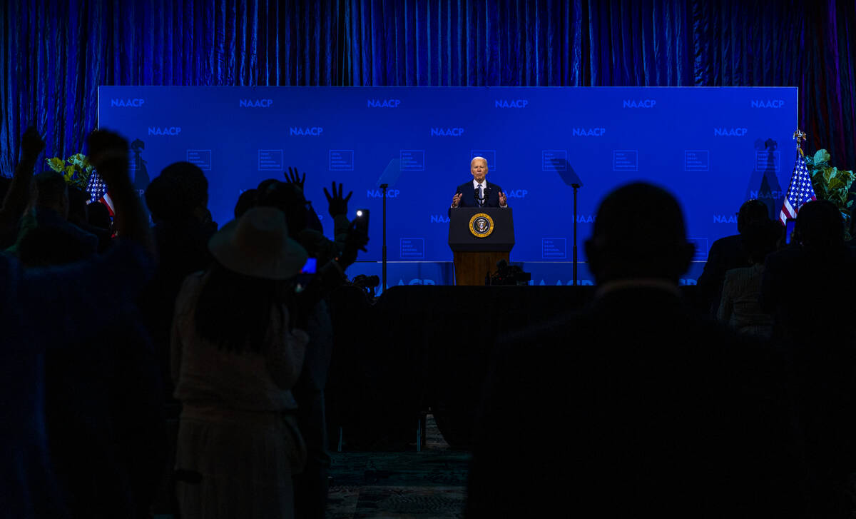 Attendees shout "4 more years" as President Joe Biden speaks during the 115th NAACP N ...