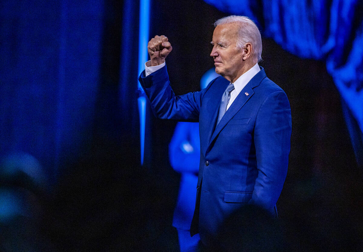 President Joe Biden pumps his fist to the crowd after speaking during the 115th NAACP National ...