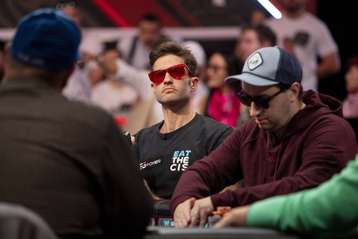 Joe Serock, left, watches Jordan Griff, right, compete in the final table of the World Series o ...