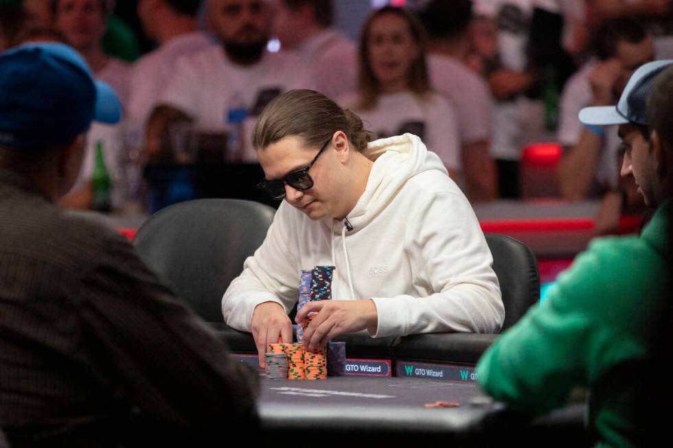 Niklas Astedt stacks his newly won chips during the final table of the World Series of Poker Ma ...