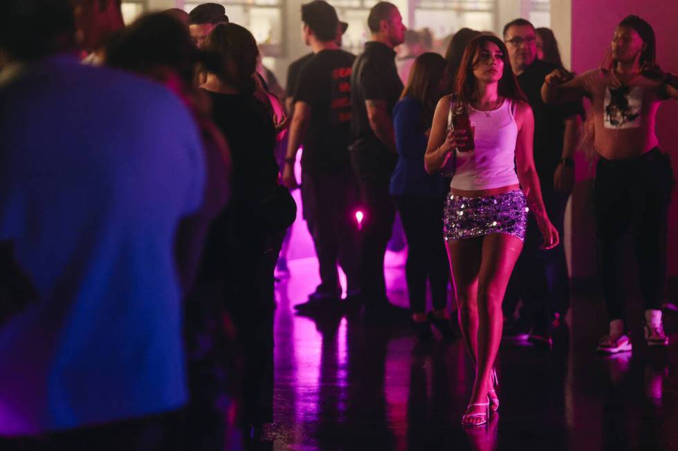 A club goer walks across the floor during a soft opening event at Substance, a new nightclub at ...