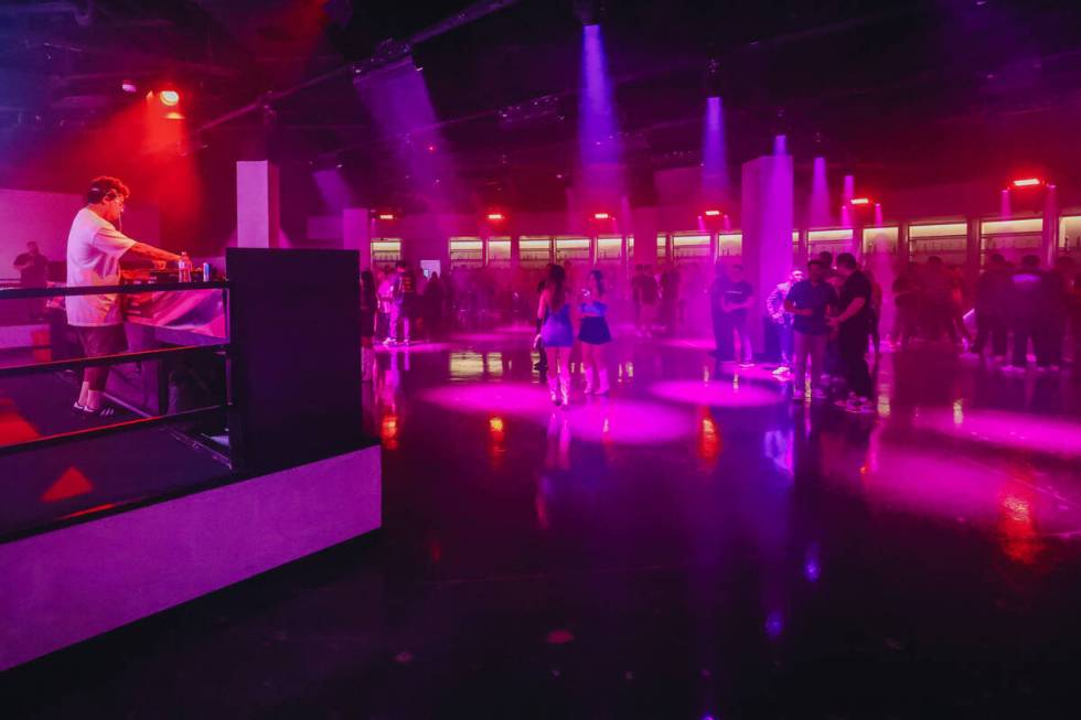 A DJ plays music during a soft opening event at Substance, a new nightclub at Neonopolis on Thu ...