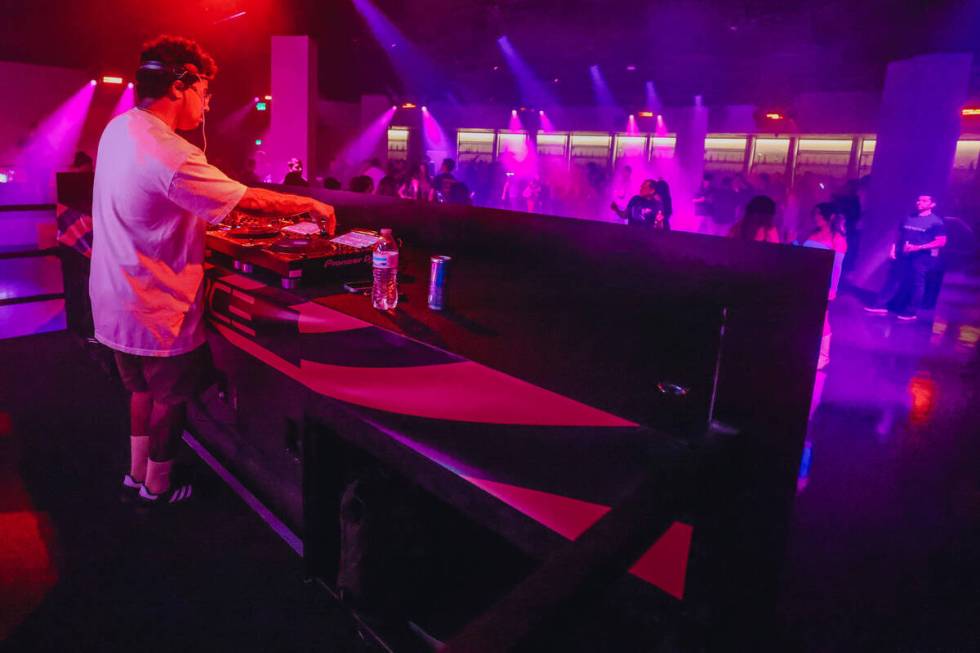 A DJ plays music during a soft opening event at Substance, a new nightclub at Neonopolis on Thu ...