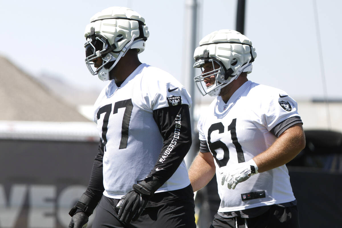 Raiders offensive tackle Thayer Munford Jr. (77) and guard Jordan Meredith (61) take the field ...