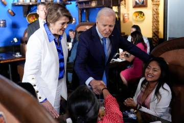 President Joe Biden and Maritza Rodriguez, Biden for President Latina adviser, greets patrons a ...