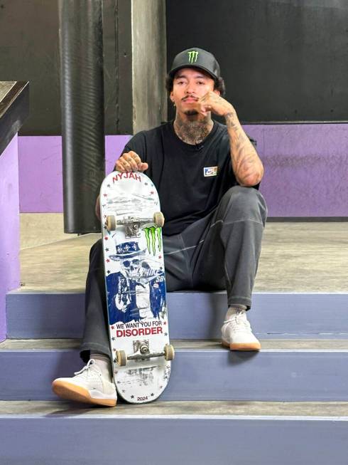 Nyjah Huston poses with his board at his private skate park in San Clemente, Calif., June 12, 2 ...